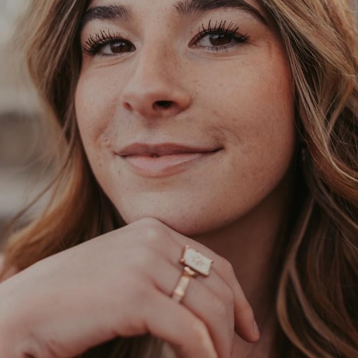 Priya Mehta, Lead Design Curator at Luminous Growth Matrix, reviewing corporate floral arrangements